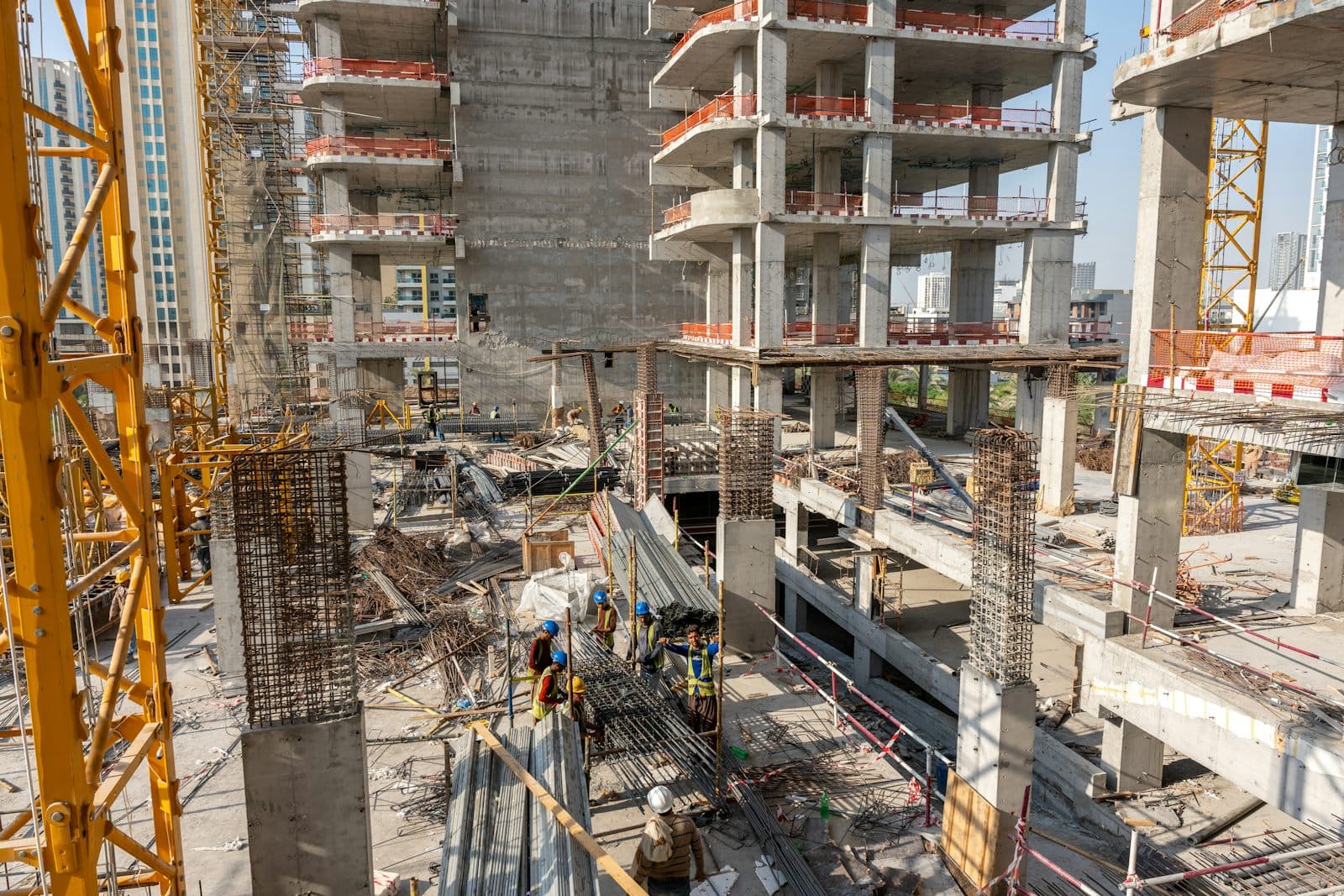 Steel and glass high-rise under construction in daylight