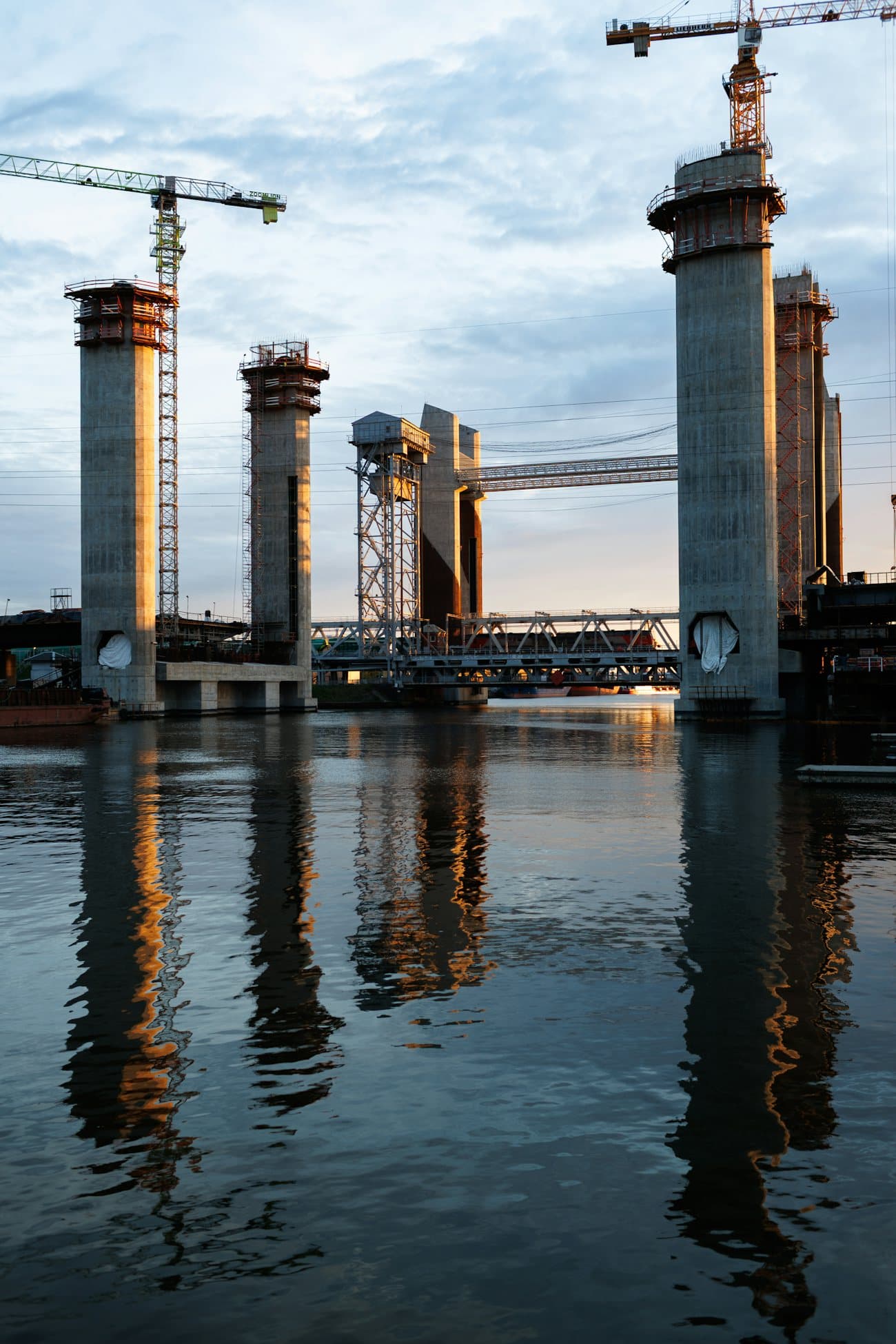 Crawler crane lifting a bridge girder into place
